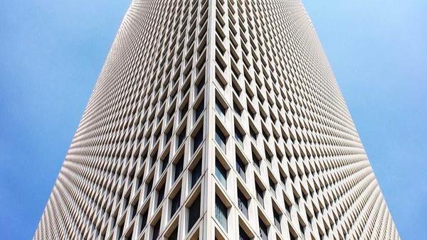 Illustrative geometric high-rise viewed from below